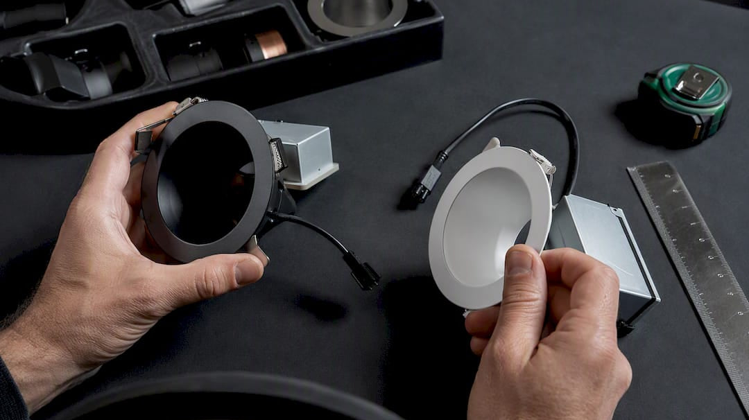 Hands comparing anonymous lighting components