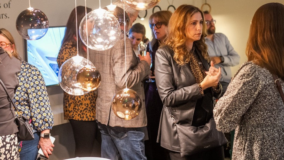 women at a lighting event