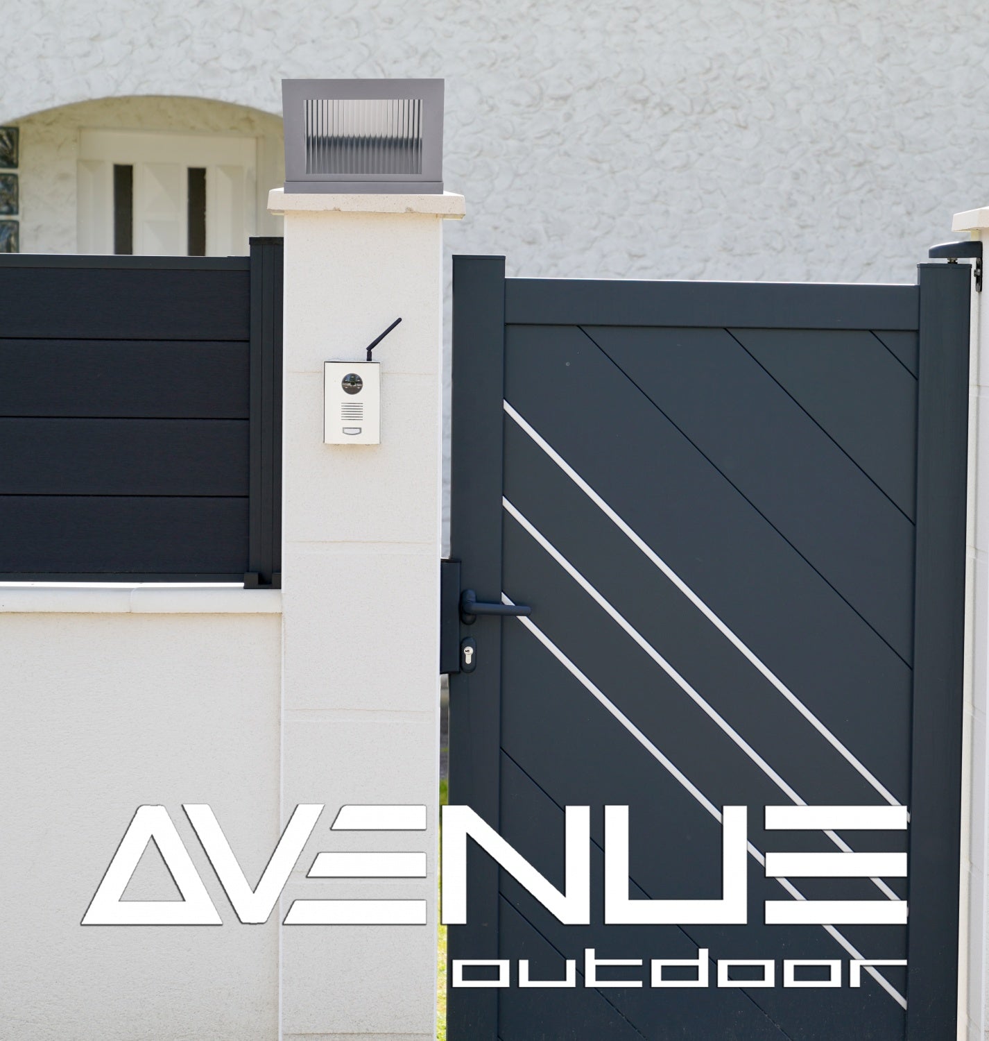 Avenue Outdoor LED Pillar Mount AV9904-SLV installed atop masonry pillar — silver cap with LED glowing downward, warm ambient light on pillar