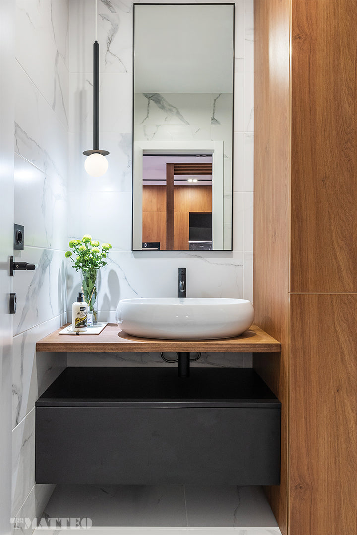 Matteo Lighting C63101MB Reigndrop Pendant in Matte Black installed over a bathroom vanity