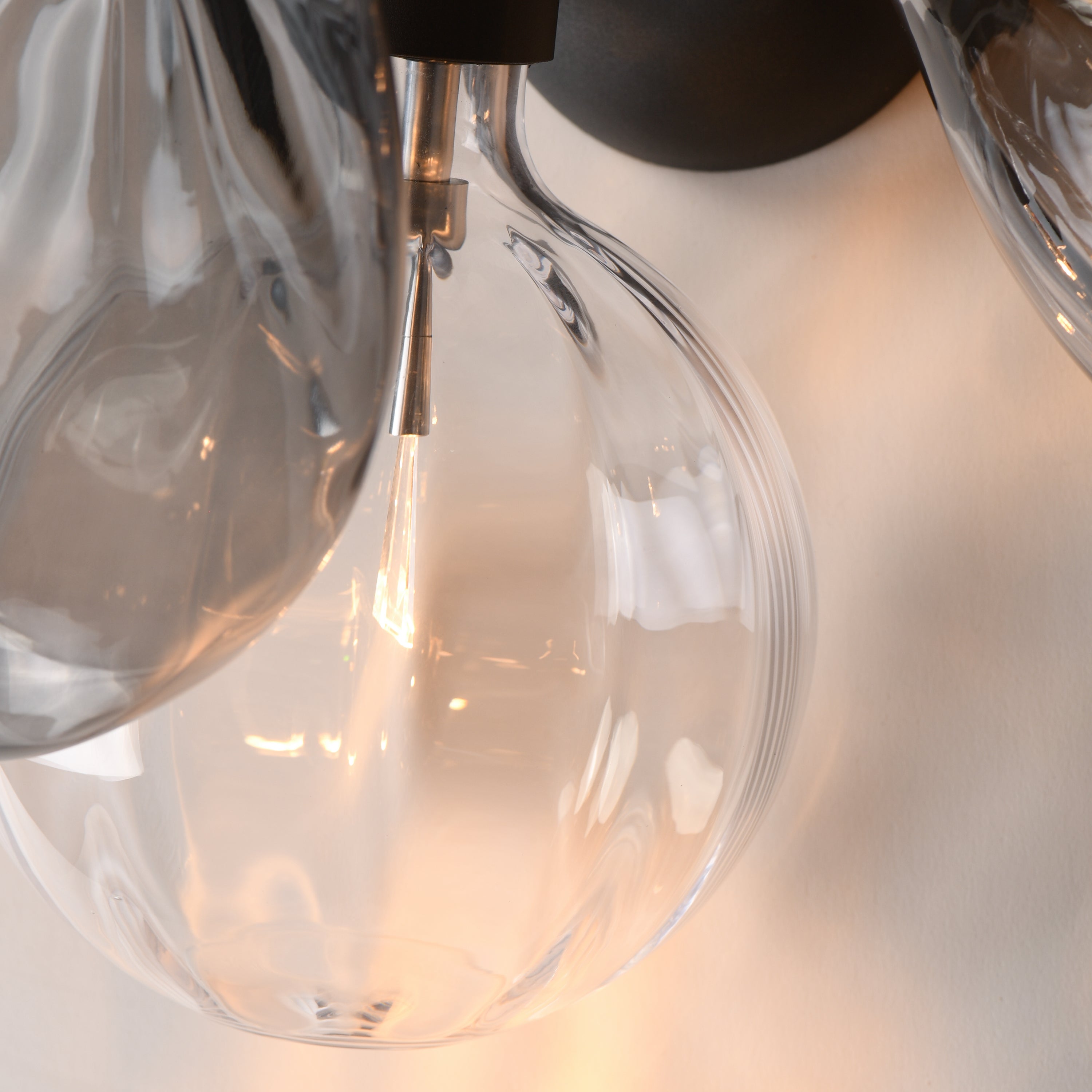 Studio M Lighting SM49300MSCLBK Ray Dance Cluster Wall Sconce in Black with Smoke and Clear glass, close-up detail view