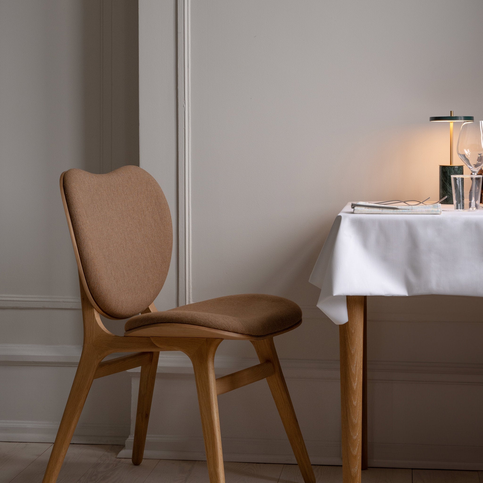 Umage A Conversation Piece dining chair styled in a room setting