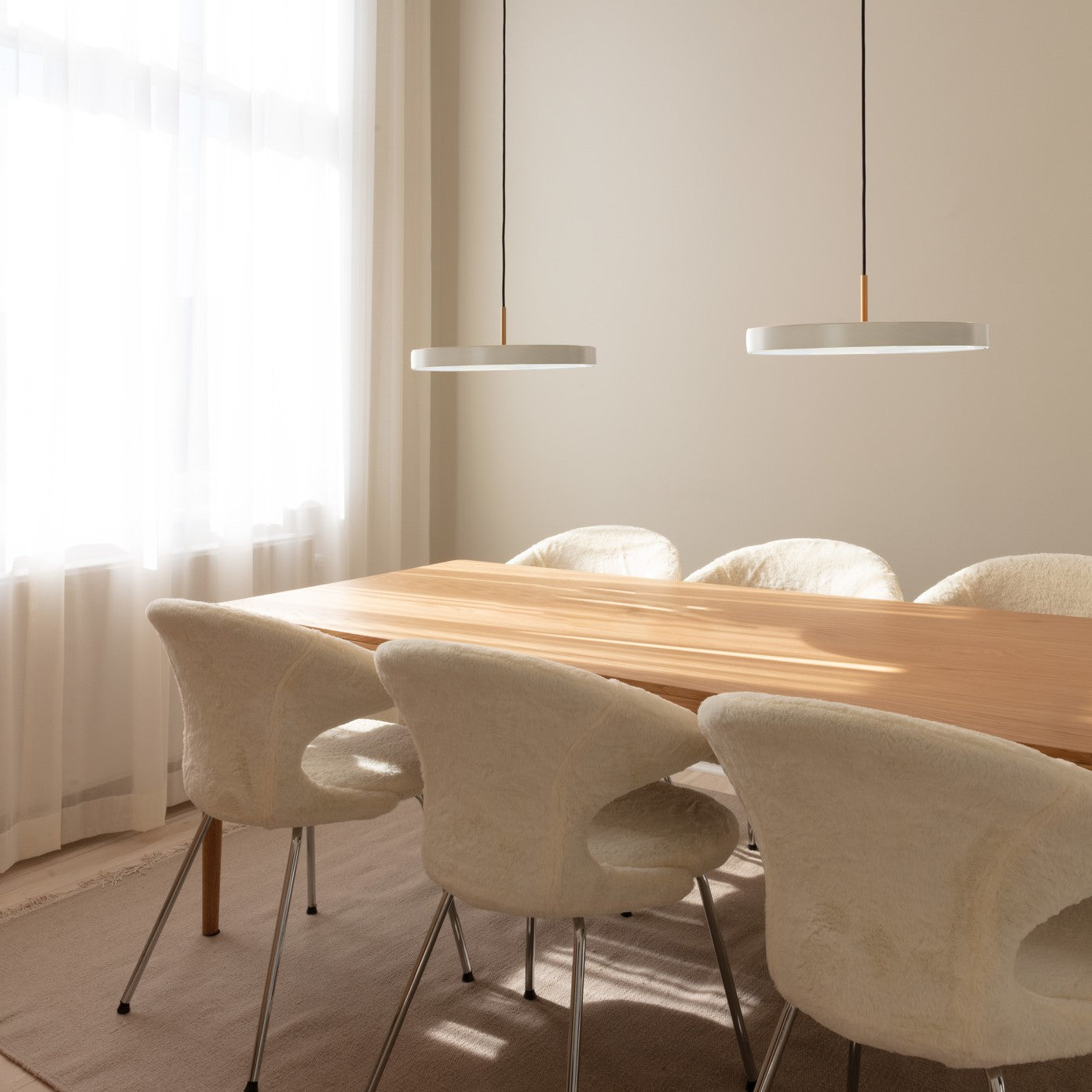 Umage Asteria LED Pendant in Pearl White in a styled dining room