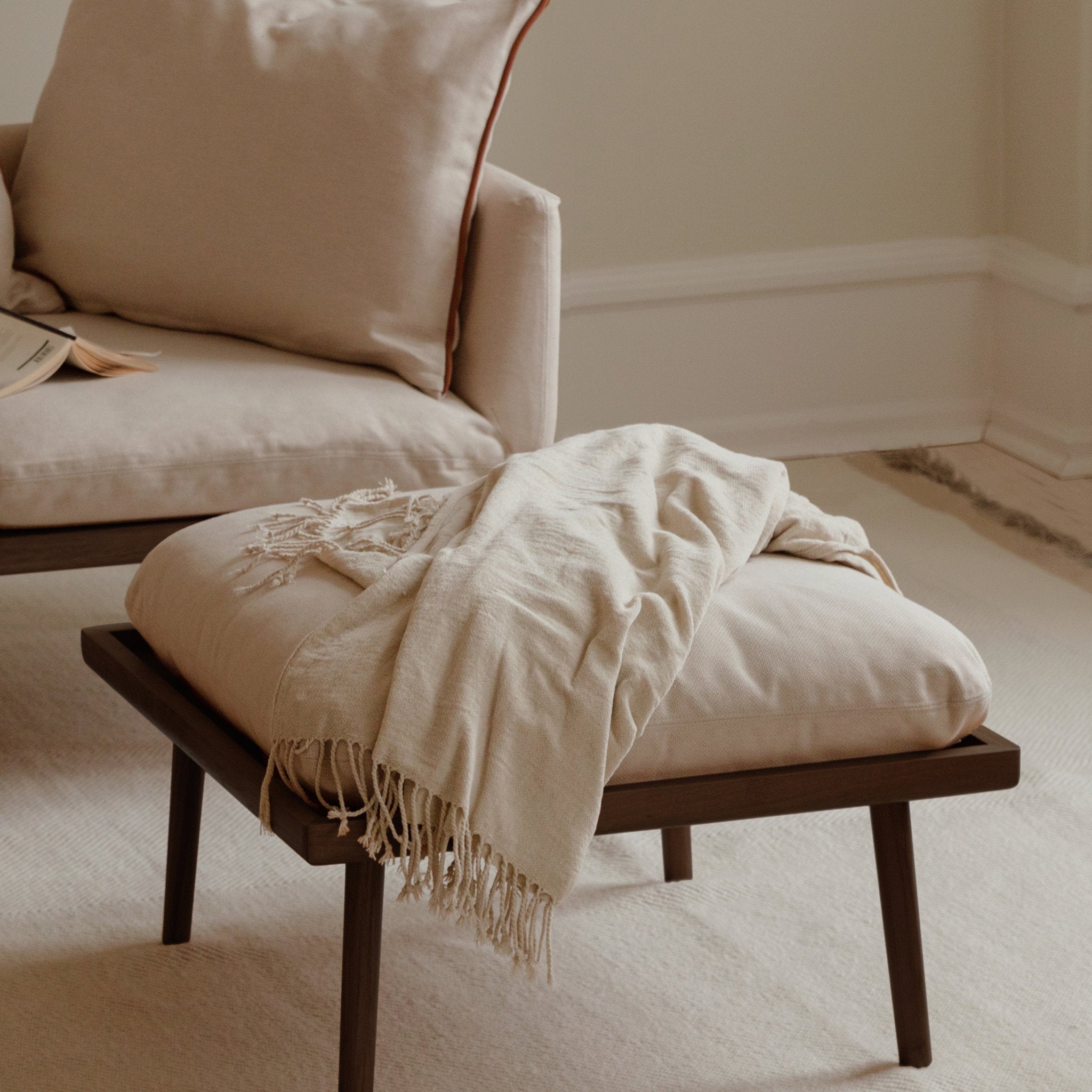 Umage Lounge Around Shuffle pouffe styled in a room setting