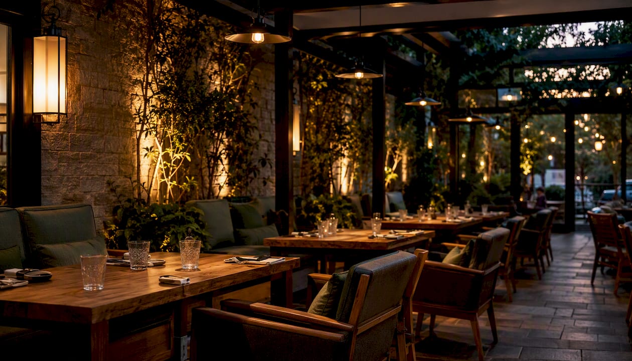 Restaurant dining area with layered warm lighting