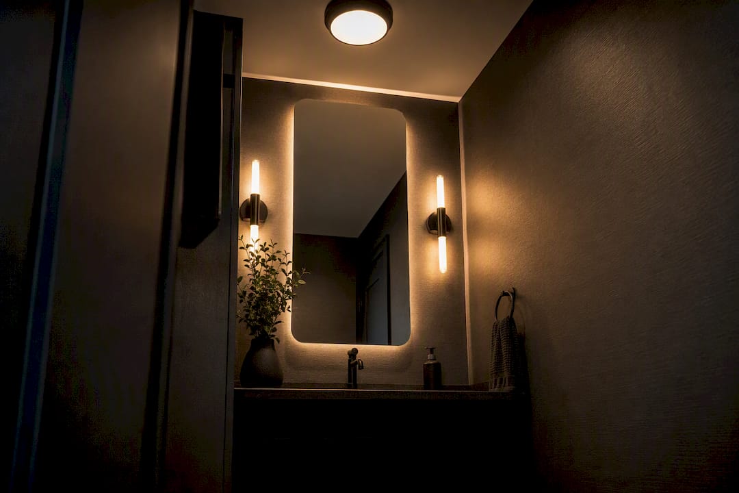 Powder room with ambient, task, and accent lighting