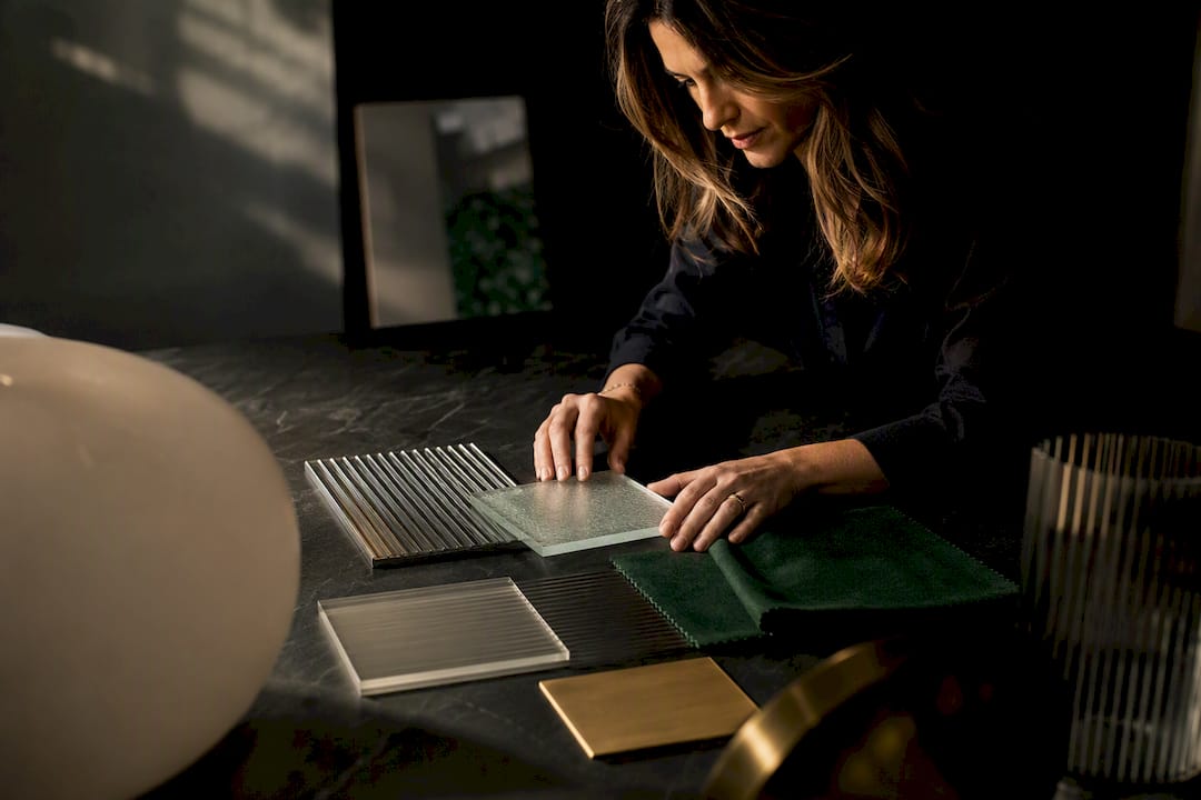 Designer comparing Italian lighting material samples