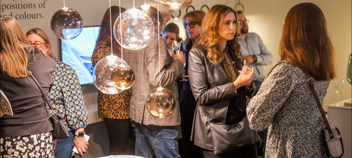 women at a lighting event