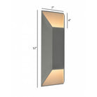 Avenue Outdoor Large Cylindrique LED Murale AV9900-SLV installé à l'extérieur — large cylindre argenté projetant une lumière circulaire chaude sur le mur environnant
