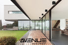 Avenue Outdoor LED Flushmount AV9889-BLK three-quarter angle — low-profile black disc showing shallow ceiling mount depth