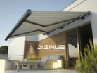 Avenue Outdoor Mini LED Wall Sconce AV9890-SLV three-quarter angle — slim silver profile showing flat mounting backplate