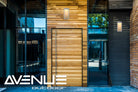 Avenue Outdoor Rectangular LED Wall Sconce AV9901-SLV installed on exterior — silver sconce with clean diffused glow on wall surface