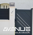 Avenue Outdoor LED Pillar Mount AV9904-SLV installed atop masonry pillar — silver cap with LED glowing downward, warm ambient light on pillar