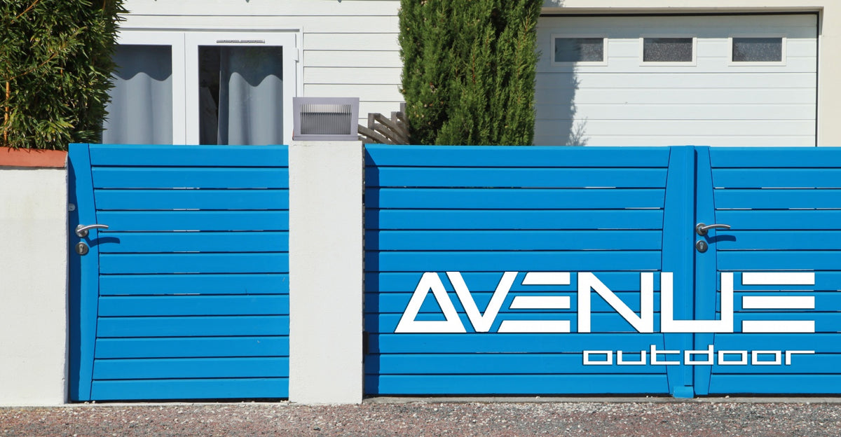 Avenue Outdoor LED Pillar Mount AV9905-SLV installed atop masonry pillar — silver cap with LED glowing downward, warm ambient light on pillar