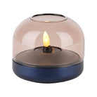Glow 08 candle holder with smoky dome and navy base, housing an LED candle.