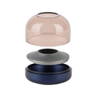 Glow 08 candle holder with pink glass dome, gray ring, and navy base (disassembled).