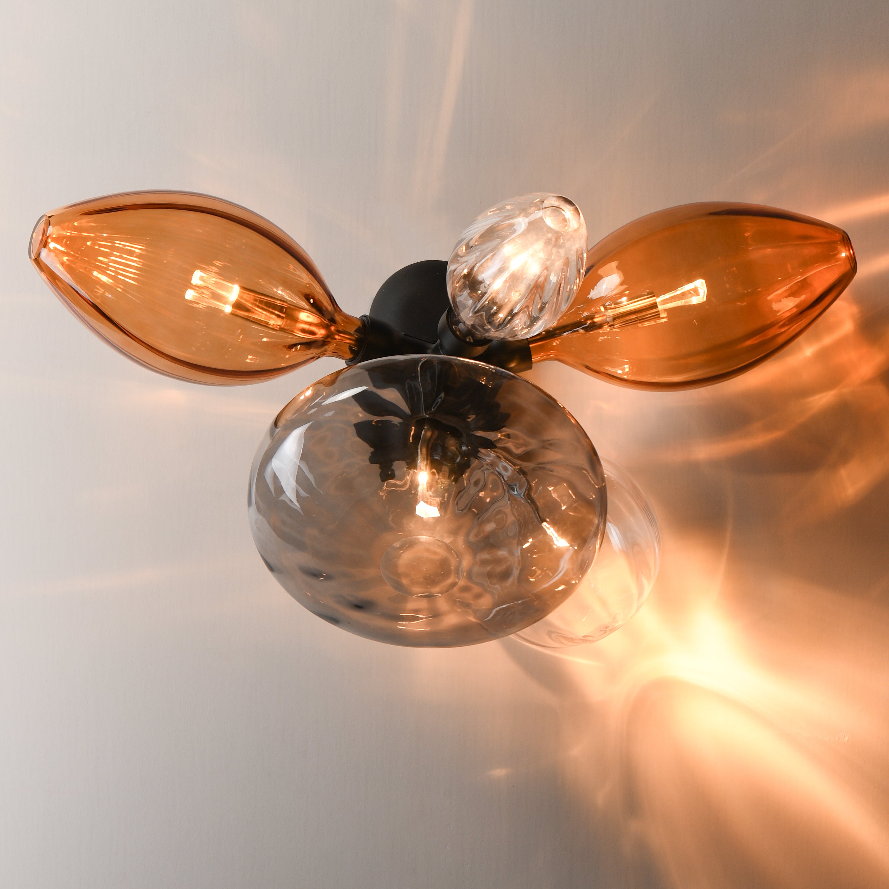 Studio M Lighting SM49300EMSKBK Ray Dance Cluster Wall Sconce in Black with Ember and Smoke glass, side profile view