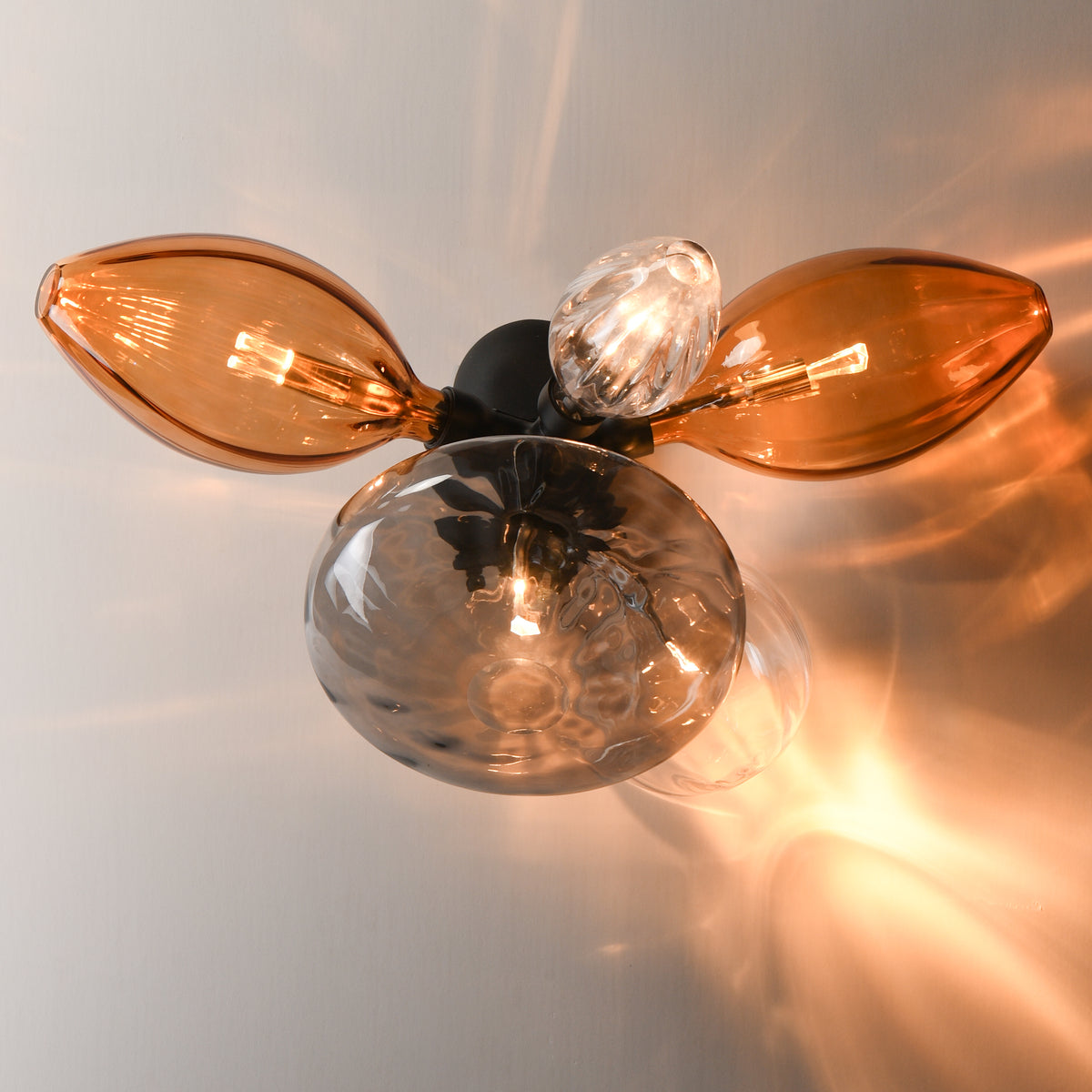 Studio M Lighting SM49300EMSKBK Ray Dance Cluster Wall Sconce in Black with Ember and Smoke glass, side profile view