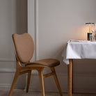 Umage A Conversation Piece dining chair styled in a room setting
