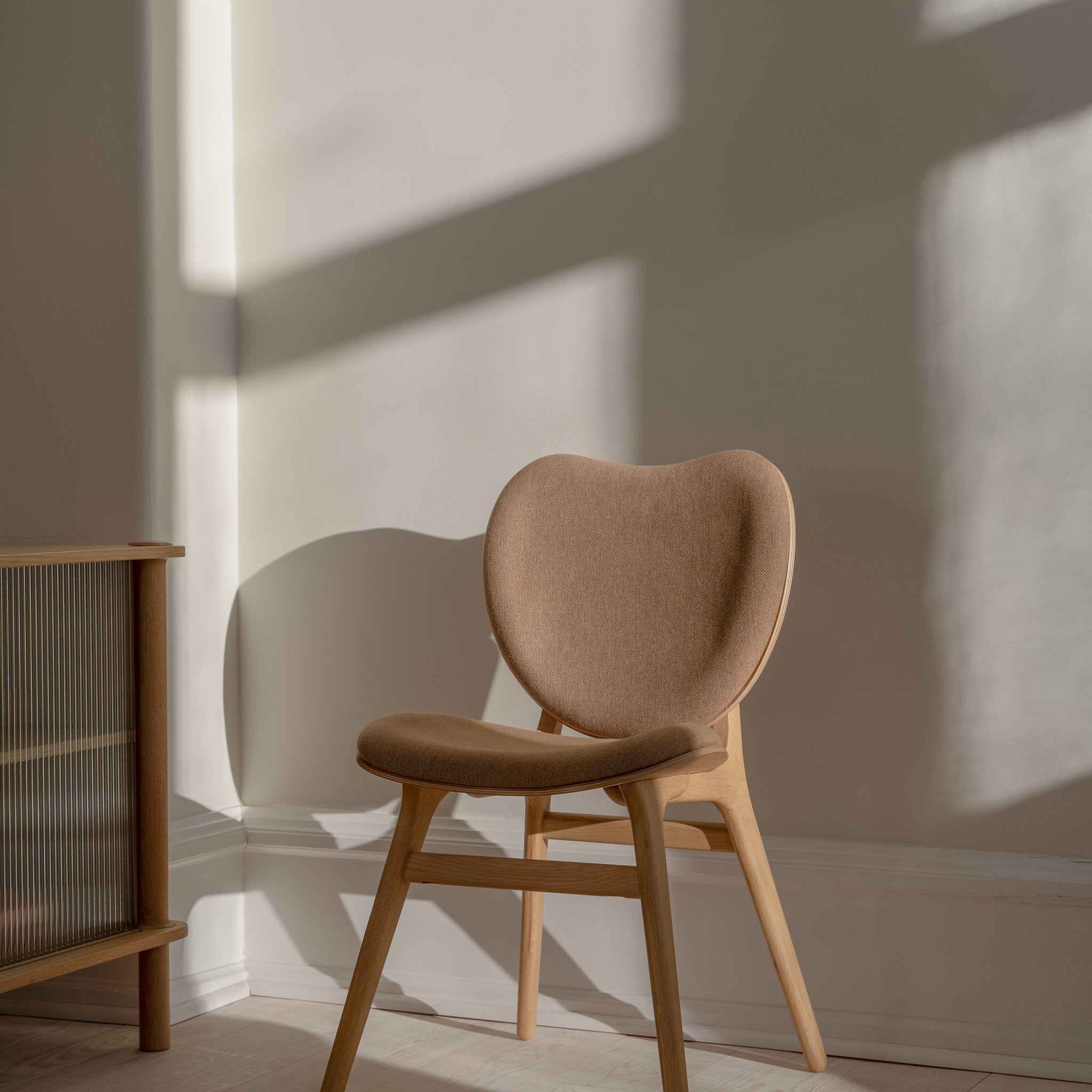 Umage A Conversation Piece dining chair styled in a room setting