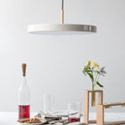 Umage Asteria LED Pendant shown in an interior setting