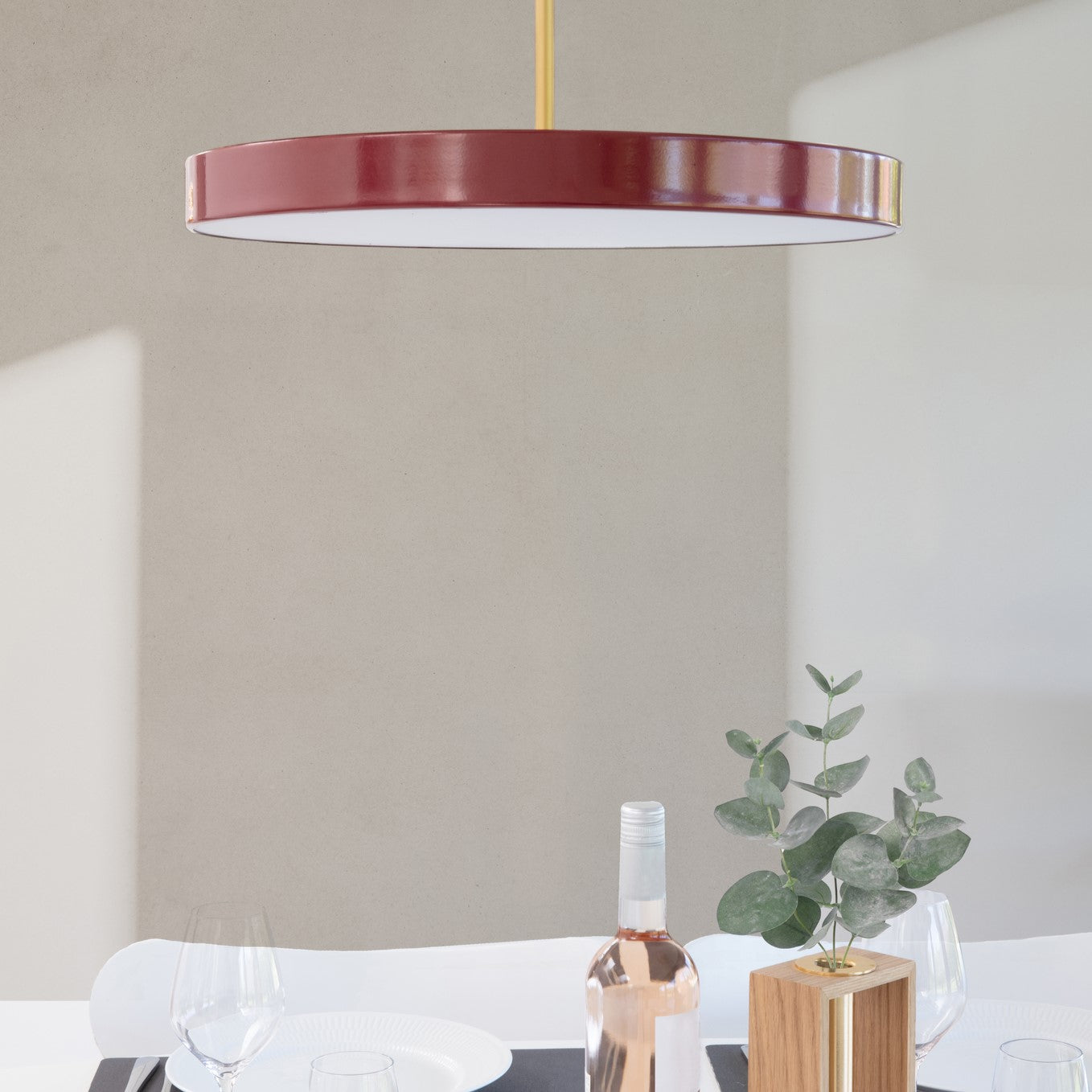 Umage Asteria LED Pendant in Ruby Red in an interior setting