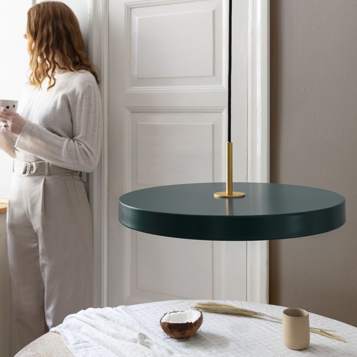 Umage Asteria LED Pendant in Forest Green in an interior setting