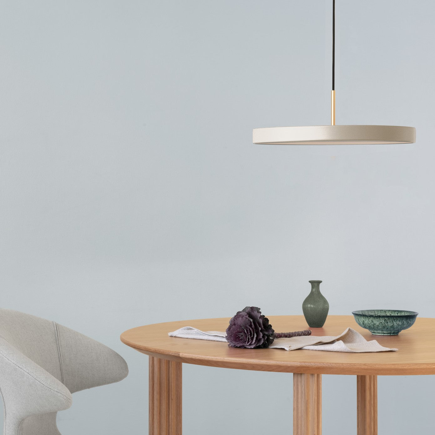 Umage Asteria LED Pendant in Pearl White above an oak dining table