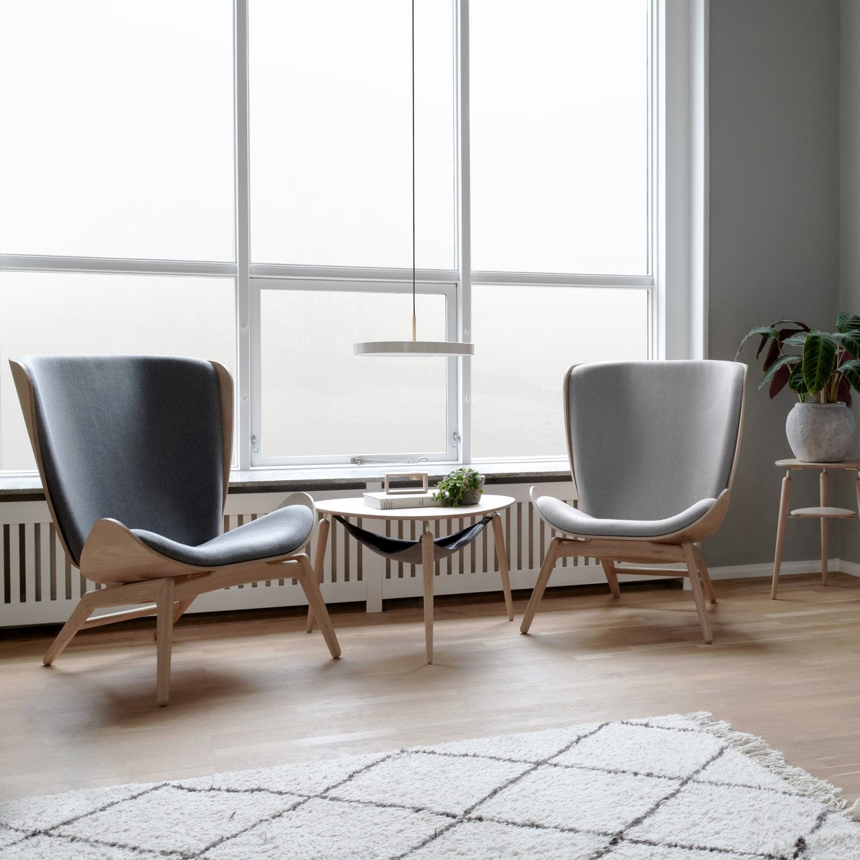 Umage Asteria LED Pendant in a living room with Umage furniture