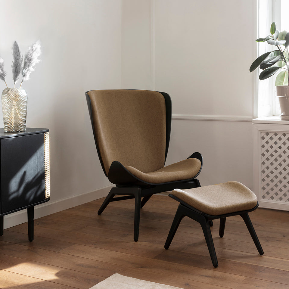 Umage The Reader Ottoman in black oak with Sugar Brown, styled with Treasures